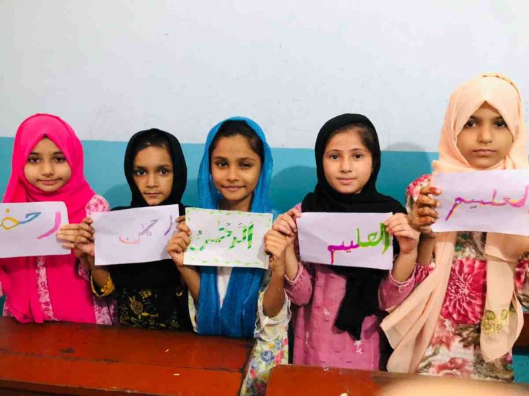 Summer Camp 2025: Baithak School girls proudly share their colorful drawings of Asma ul Husna, blending art with faith and love.