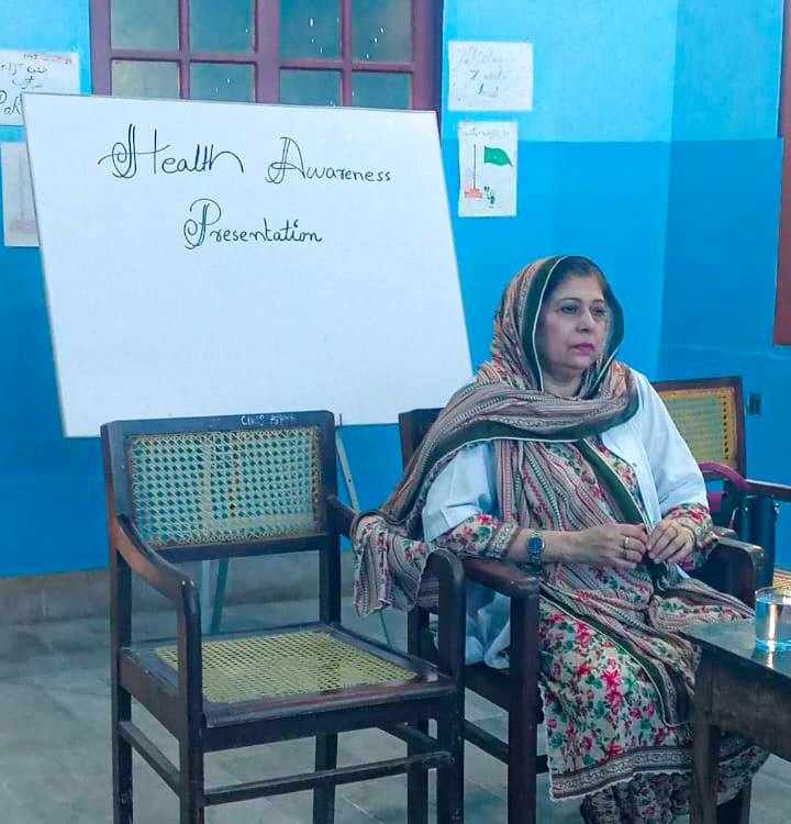 Dr. Abida conducting health awareness session with students at Baithak School Hyderabad.
