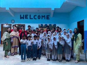 Students from Baithak School and The Next School posing together with happy, excited faces