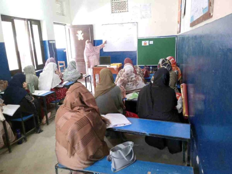 Baithak School Network facilitators conducting a subject training session with cluster representatives.
