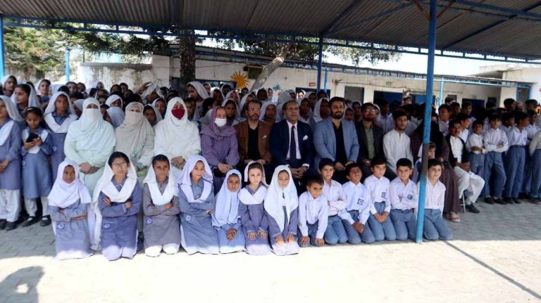 Group photo of RCCI leadership, Baithak School Network officials, and students during the visit to Baithak School Golra Campus.