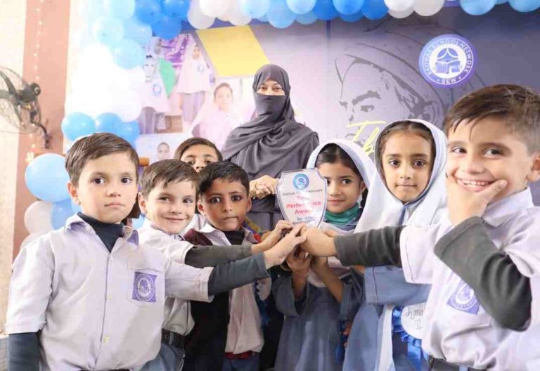 Students holding award at the Ibn-e-Sina Olympiad prize distribution ceremony.