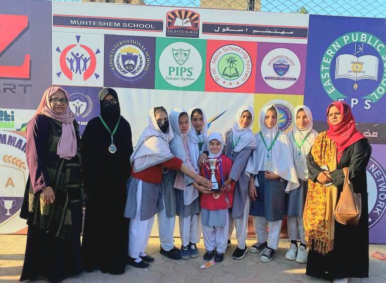 Students receiving 1st prize medal for 100 meter race at District East Olympics 2026.
