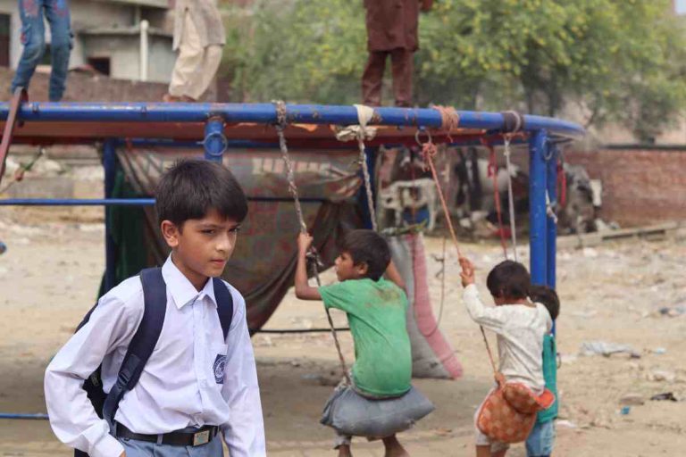 A child from a low-income community on her way to school in Pakistan