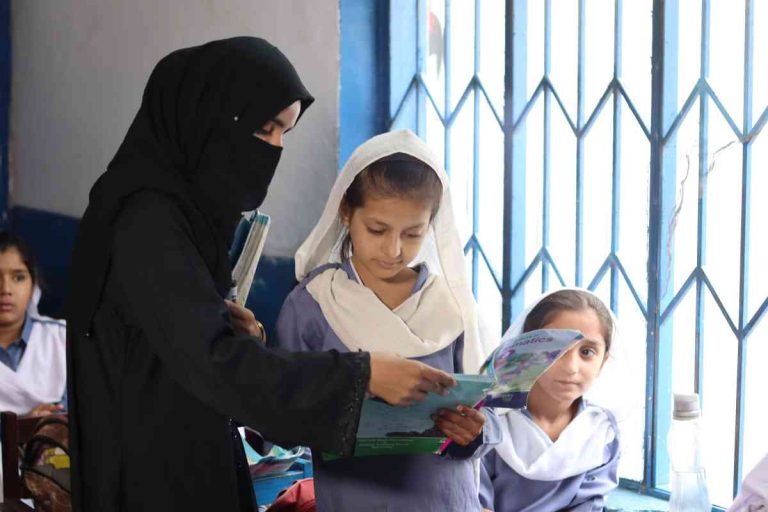 Teacher engaging students in an interactive Baithak School classroom