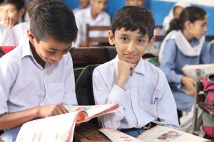 Children studying in a Baithak School classroom representing the power of education.