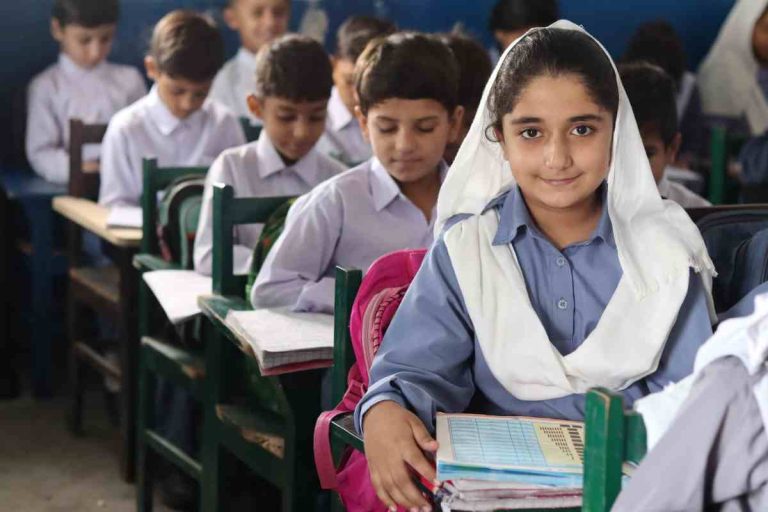 Underprivileged children studying in a Baithak School classroom in Pakistan