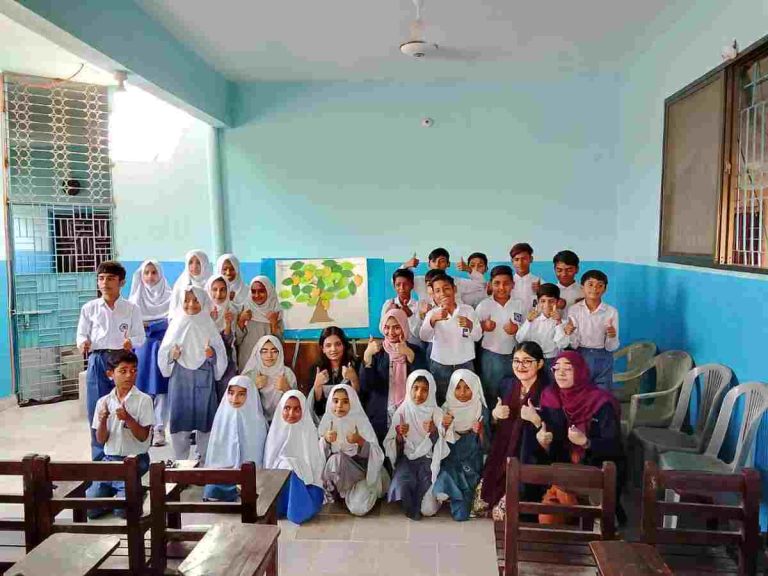 Smiling students from Bahria University and Baithak School together at Baithak School campus during CCDP session.