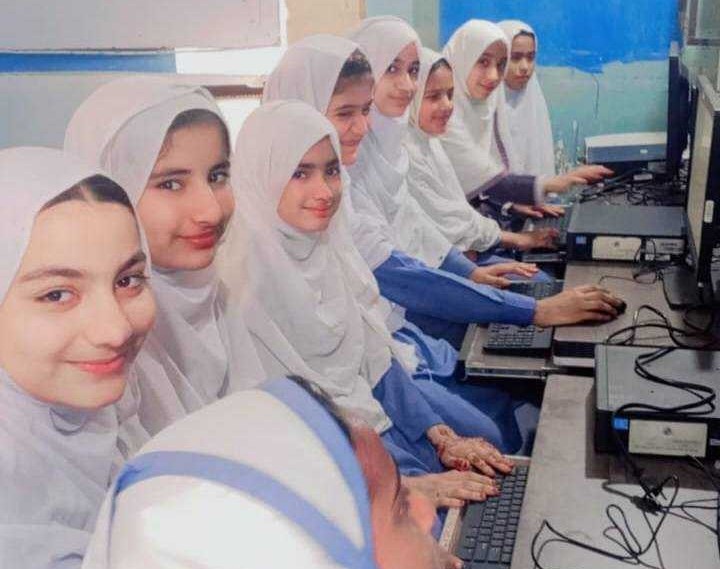 Young girls using computers at Baithak School Gotri Campus