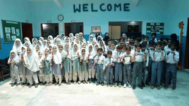 Group photo of PIMA doctors with Baithak School students after successful second phase medical camp.
