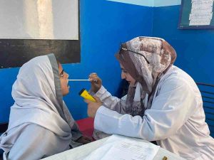 octor examining a student during medical checkup at Baithak School Sikandarabad Campus.